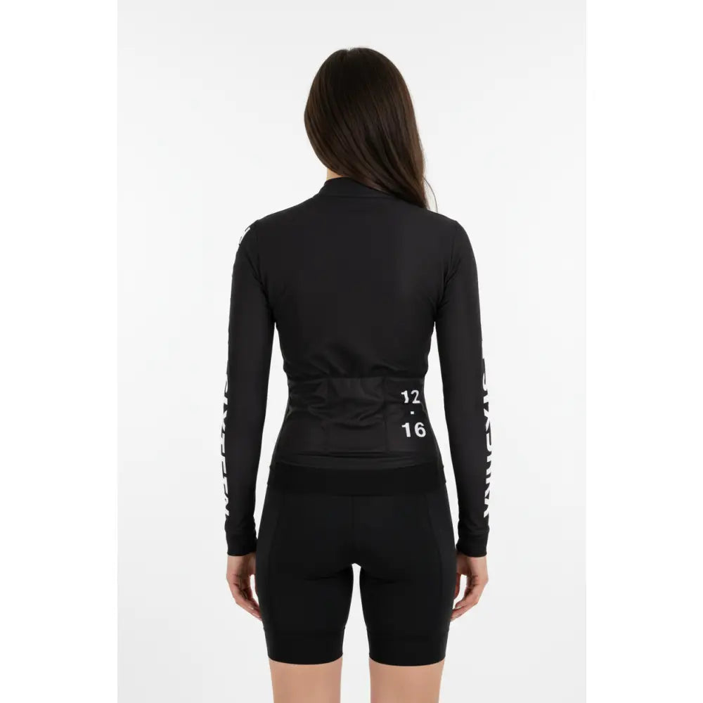 Women wearing a black Long Jersey ot with text on sleeves 